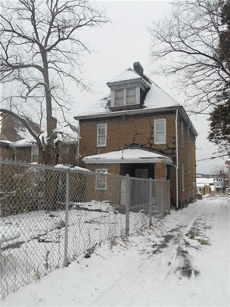 Flat, fenced back yard.