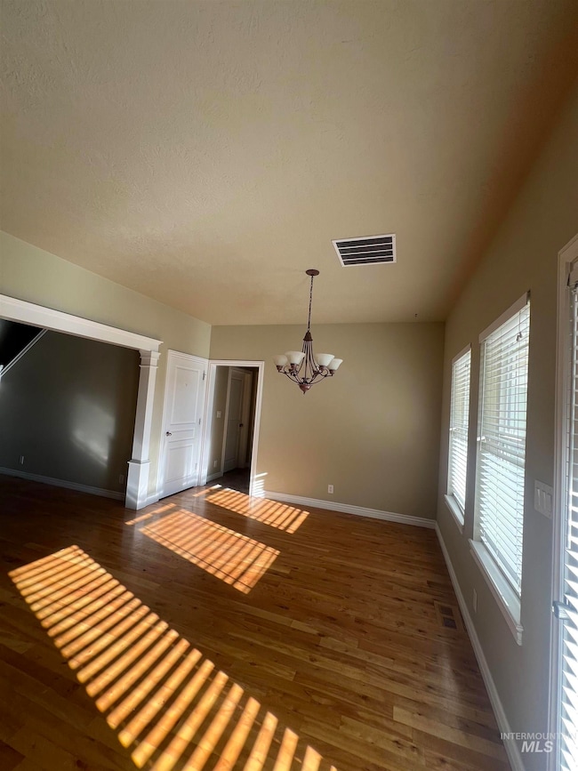 Kitchen-Informal dining room with a chandelier and wood finished floors