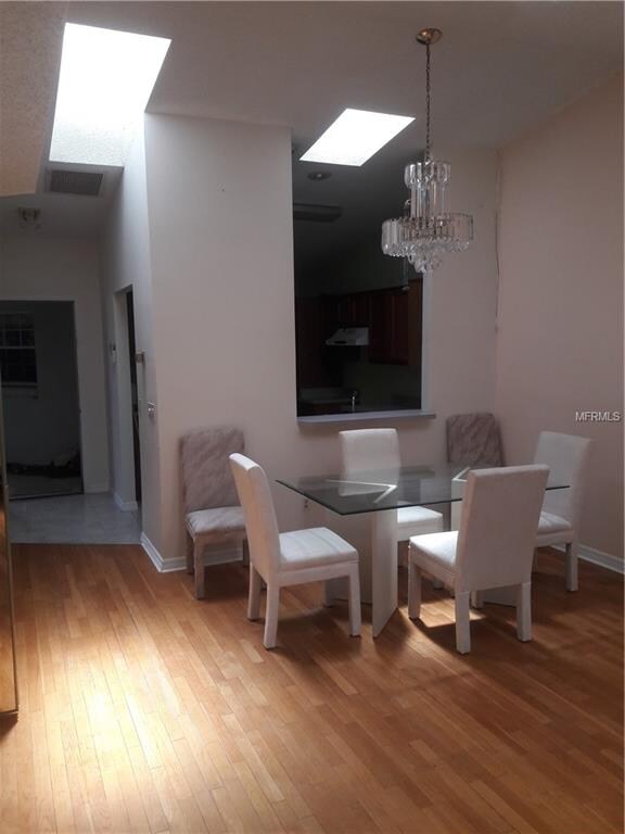 Skylights brighten the dining area. Looking toward