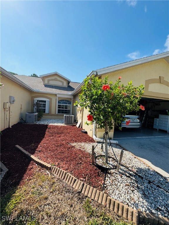 View of front of property with stucco siding, cent