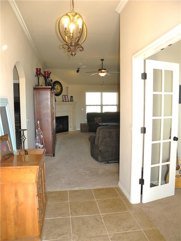 2 Chandeliers at entry area, French door entry int