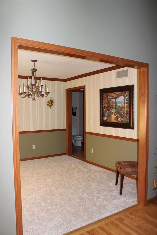 Formal dining room has entrance from front foyer a