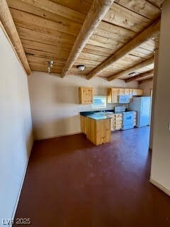 Kitchen dining area  featuring freestanding refrig
