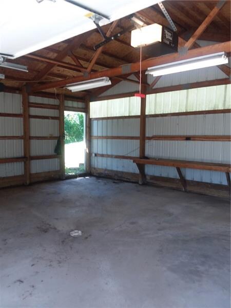 Garage has man door to path that leads to back doo
