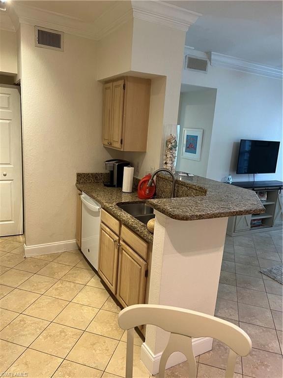 Kitchen with dishwashing machine, crown molding, a