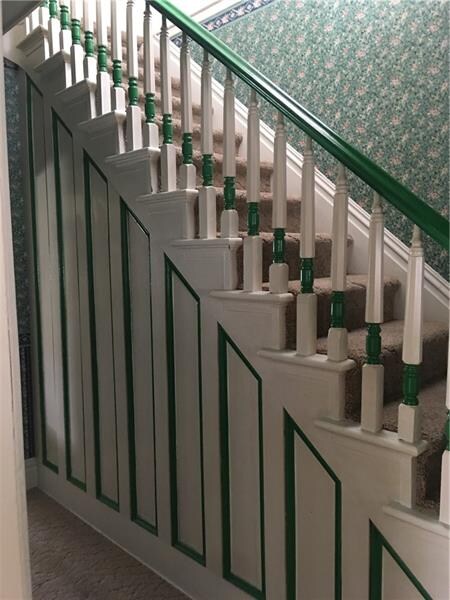 Entry way.  Beautiful wood work/stairway upstairs.