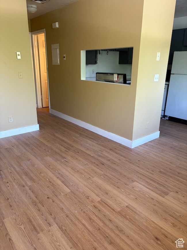 Empty room featuring wood finished floors