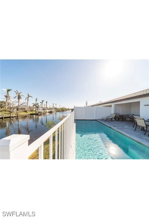 View of pool featuring a water view