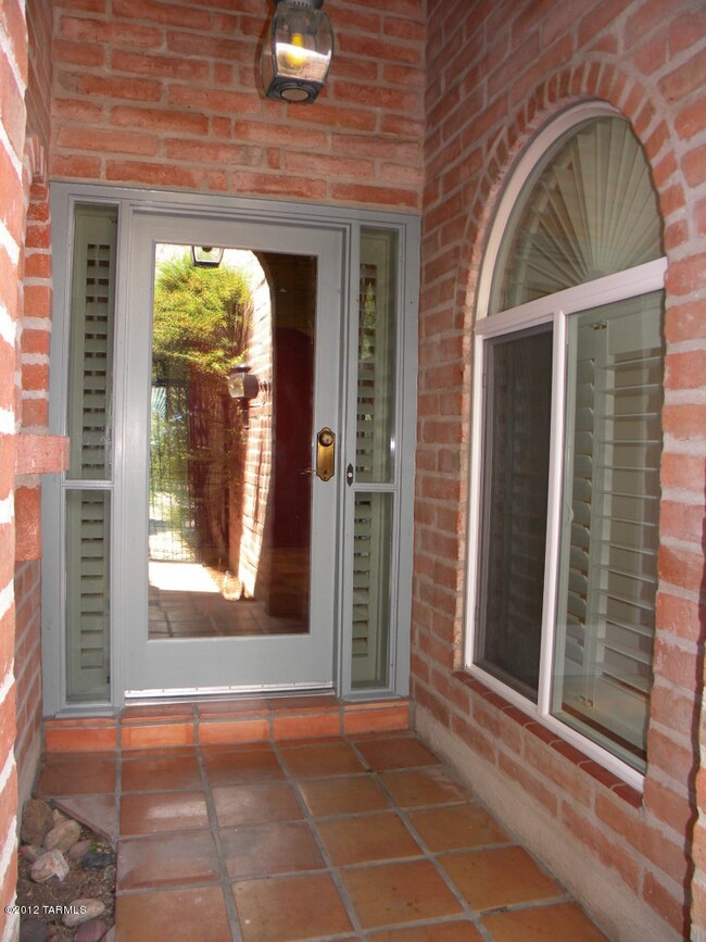 Front door next to kitchen nook