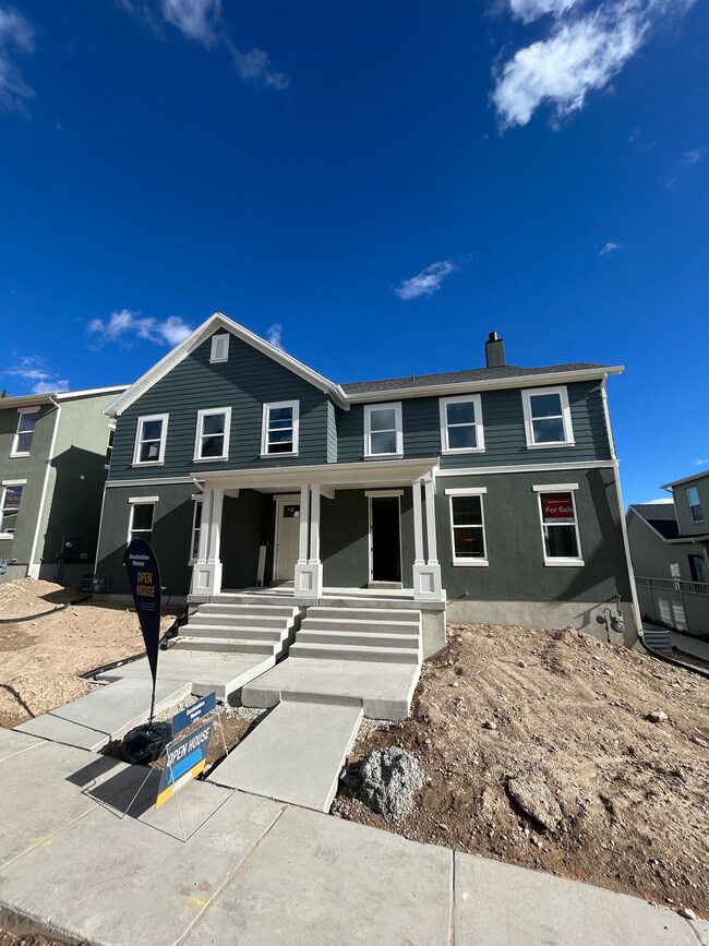 Traditional home with covered porch and a chimney