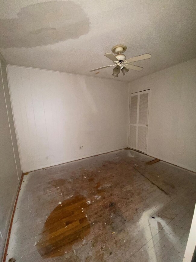 Spare room with ceiling fan