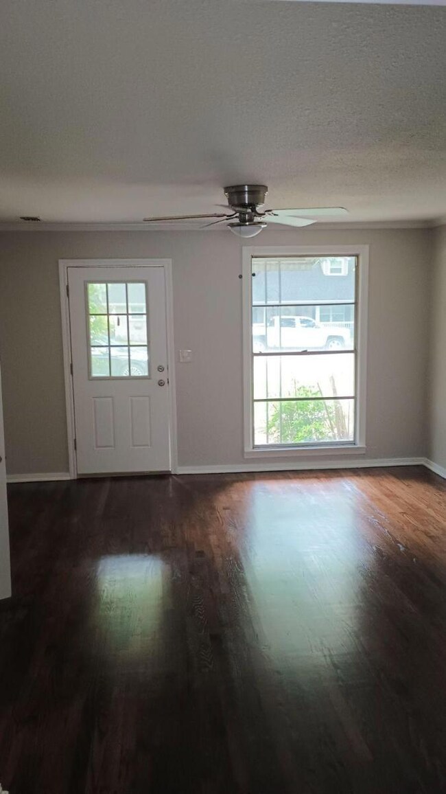 Entrance foyer featuring dark wood-type flooring, 