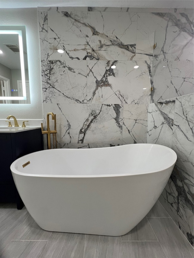 Deep soaking tub relaxing and elegant experiences.