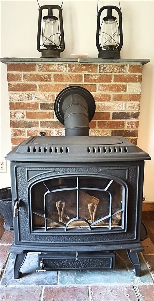 The updated wood stove gives character to the cond