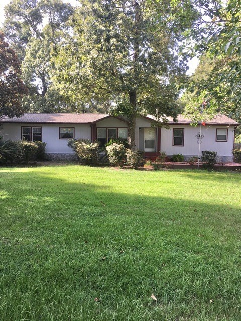 This well kept home is freshly painted, and new roof just installed.  Front deck is a wonderful place to spend a cool afternoon.  Beautiful trees surround this 1/2 ac. lot in a restricted subdivision with its on community pool.