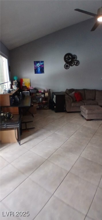 Dining area with vaulted ceiling, tile patterned f