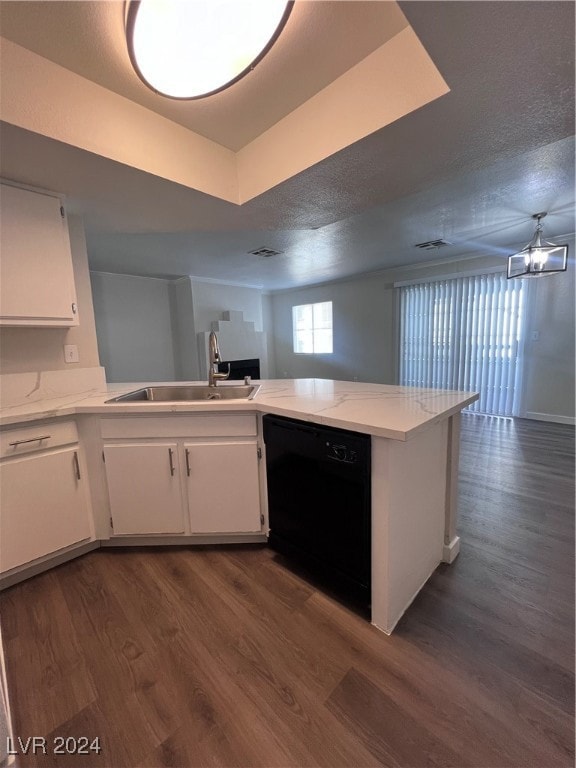 Kitchen featuring dishwasher, a sink, white cabine