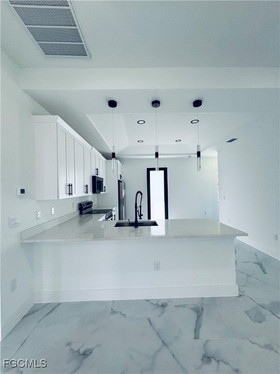 Kitchen with light stone counters, hanging light fixtures, light marble finish flooring, stainless steel electric range oven, and white cabinetry