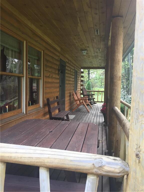 The front porch spans the full length of the house