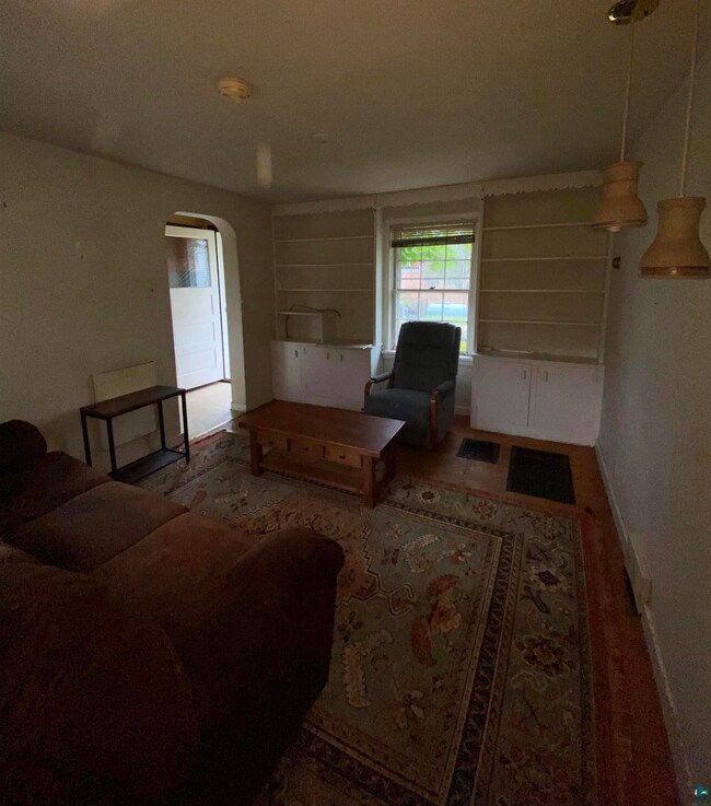 Living room with hardwood / wood-style floors