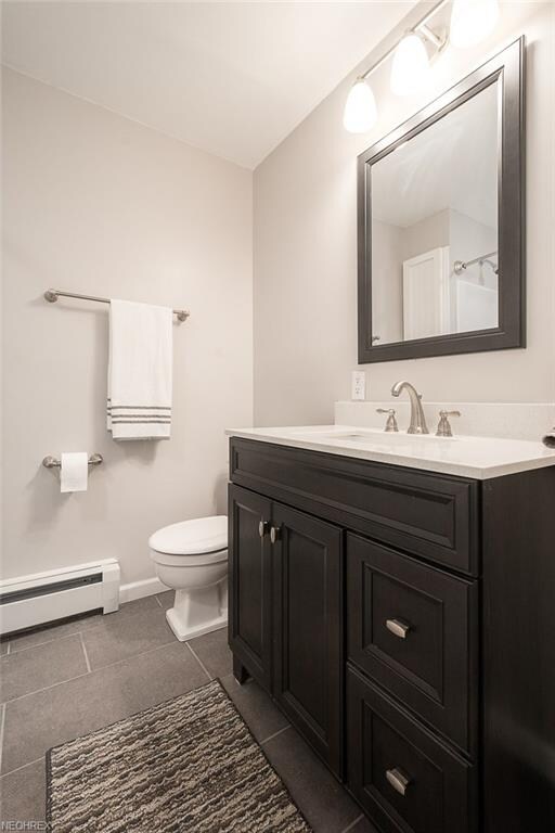 A newly created full bath on the upper level.