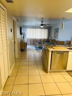 Kitchen featuring dishwasher, light tile patterned