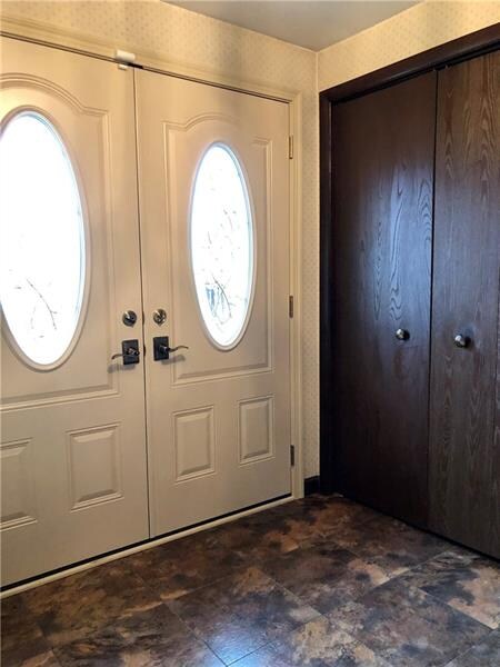 Gorgeous double doors welcome guests in the cerami