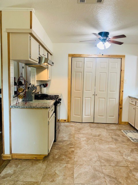 Lovely galley kitchen with beautiful tile floor
