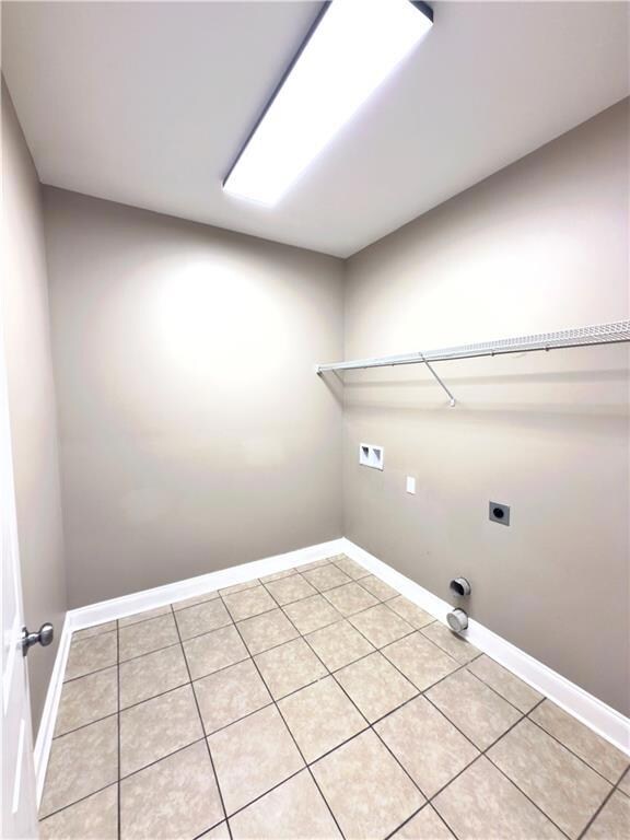 spacious 8x8 laundry room with washer& dryer connections.