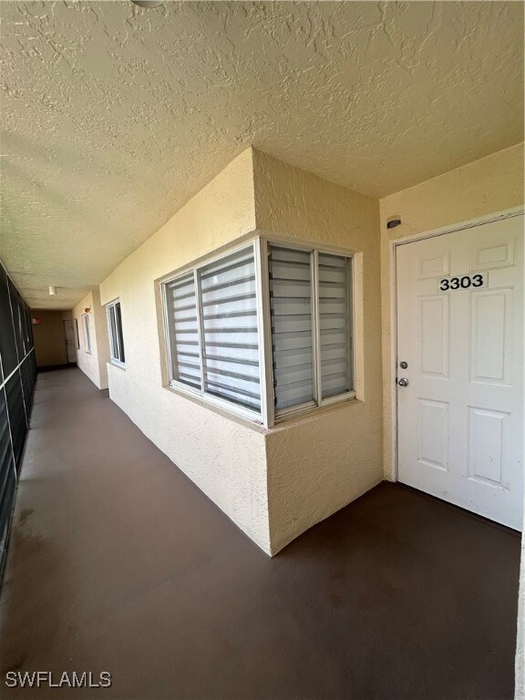 Property entrance with stucco siding