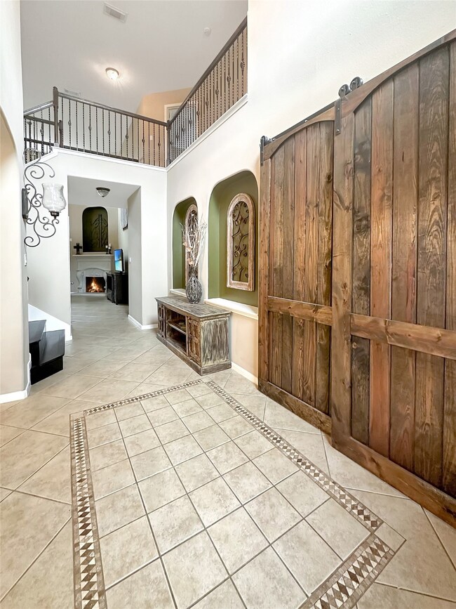 Gorgeous welcoming entry way with high ceilings.