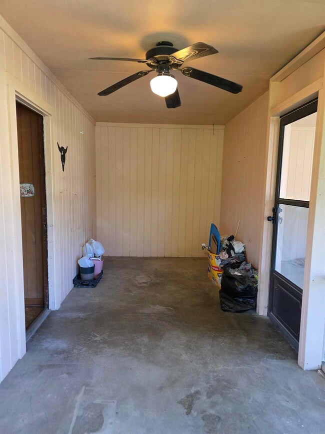 View of patio with a ceiling fan
