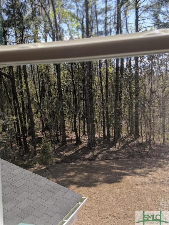 Beautiful wooded view from the Master Suite. This 