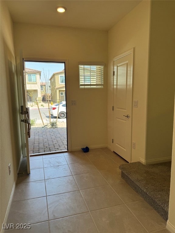 Doorway to outside with tile patterned floors, rec