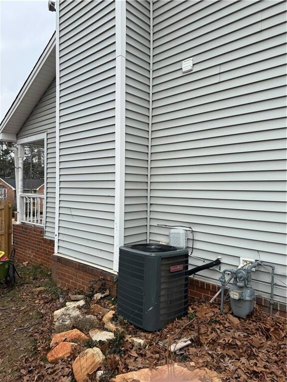 View of home's exterior featuring central AC