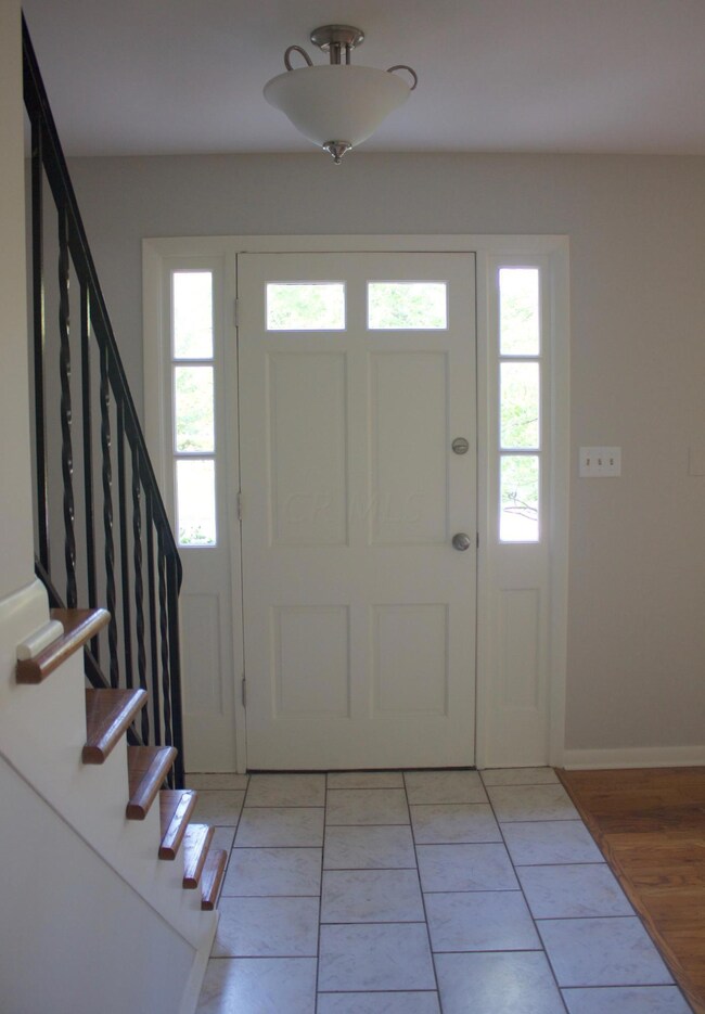 Entry with tiled floor
