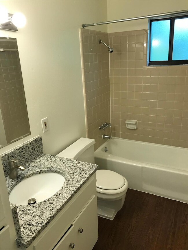 Full bathroom with toilet,  shower combination, w