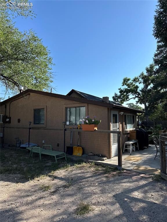 Back of house with a patio area