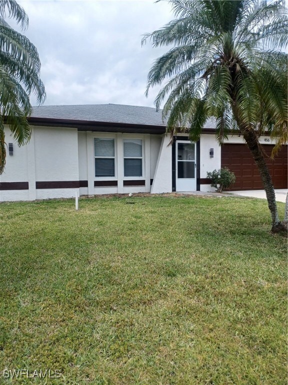 Single story home with stucco siding, a shingled r