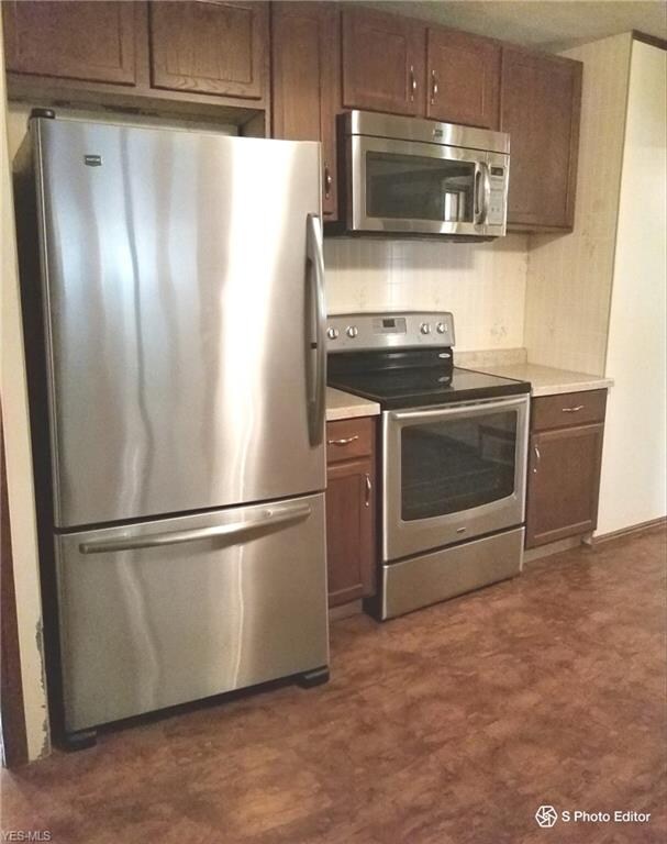 Stainless steel and black appliances.