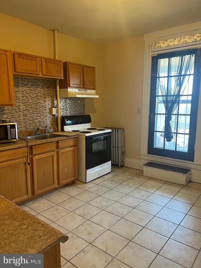 2319 W Lanvale St, Baltimore, MD 21216 - photo 2