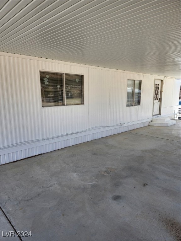 View of property exterior with entry steps and a p