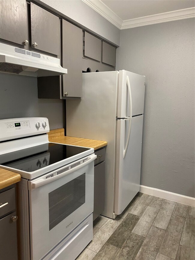 New range, hood and garbage disposal.