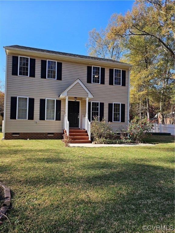 Colonial house featuring a nice front yard and fenced rear yard in the heart of Ashland.