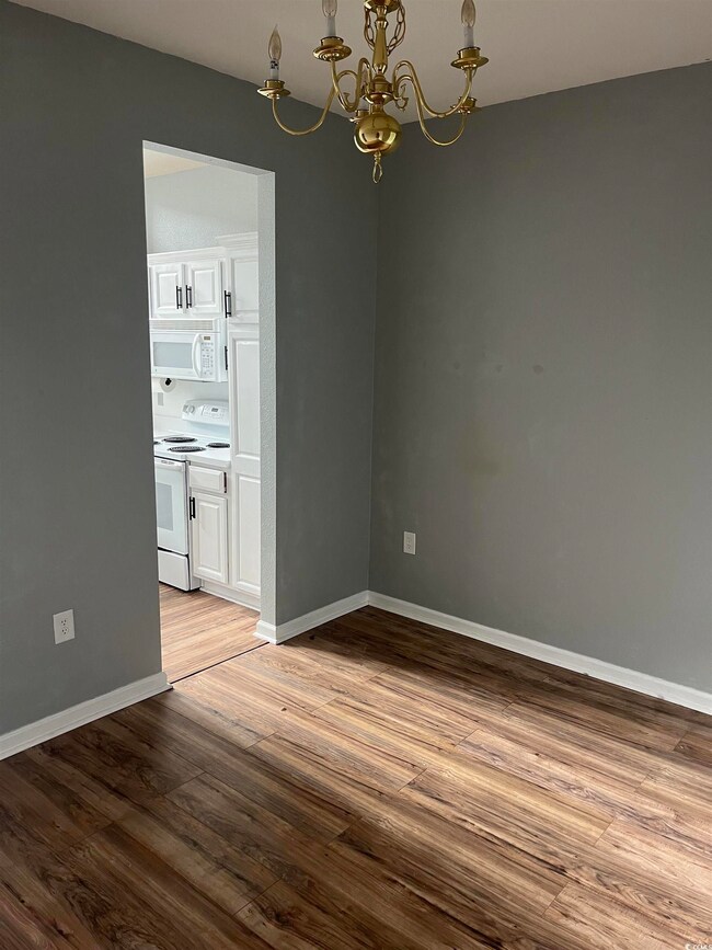 Unfurnished dining area featuring an inviting chan