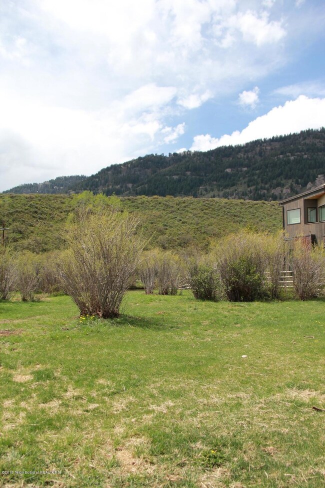 01 Property with Neighboring House Vert