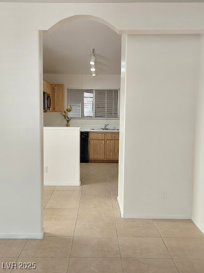 Kitchen featuring light countertops, black applian