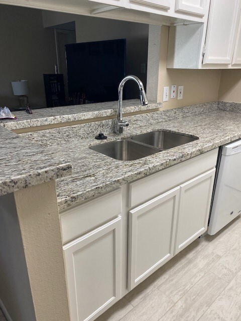 New kitchen cabinets, flooring, sinks and countert