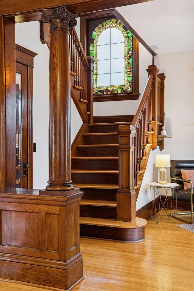 Stunning original carved columns with dramatic front staircase