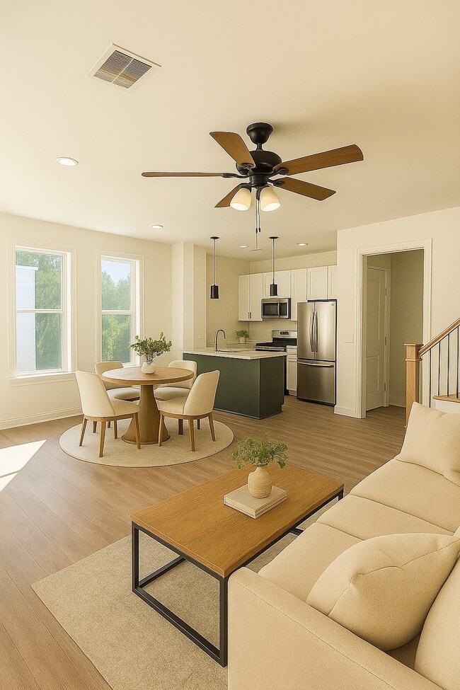 Large windows fill the space with natural light, highlighting the sleek finishes, modern fixtures, and inviting neutral tones. Perfect for entertaining or relaxing, this open layout creates a warm and welcoming atmosphere throughout. Virtually staged.